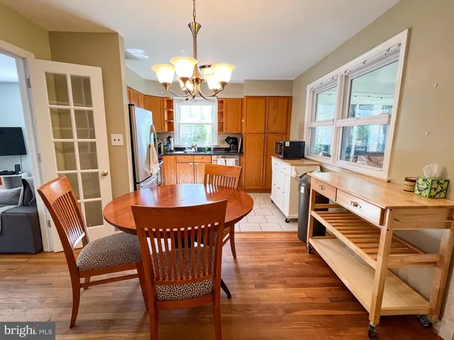 a living room with furniture and large windows