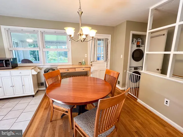a living room with furniture and large windows