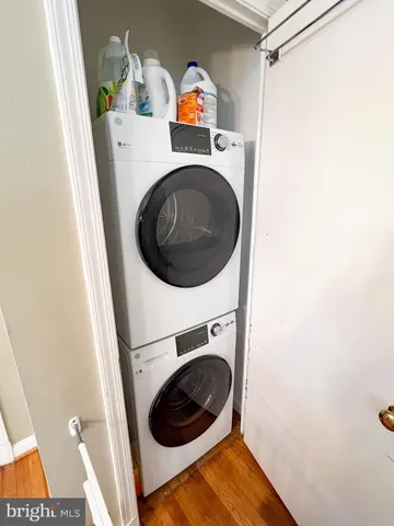 a living room with furniture a rug and a large window