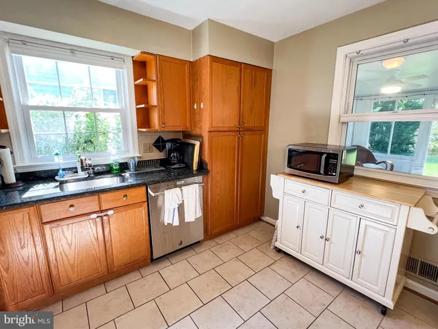 a bathroom with a sink toilet and a mirror