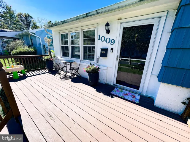 a living room with furniture rug and window