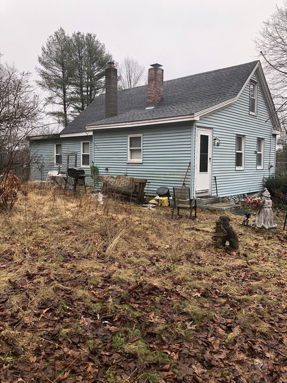 266 Pleasant Street Franklin, MA 02038 - Photo 4 of 15 a backyard of a house with yard and outdoor seating