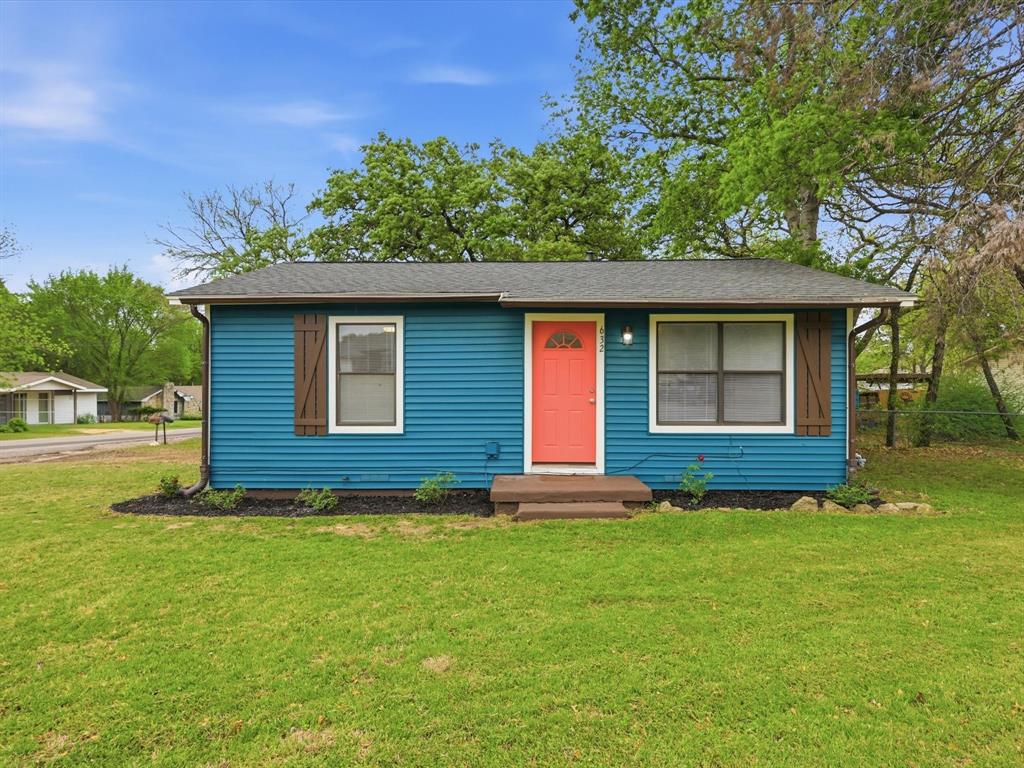Bungalow-style home with a shingled roof