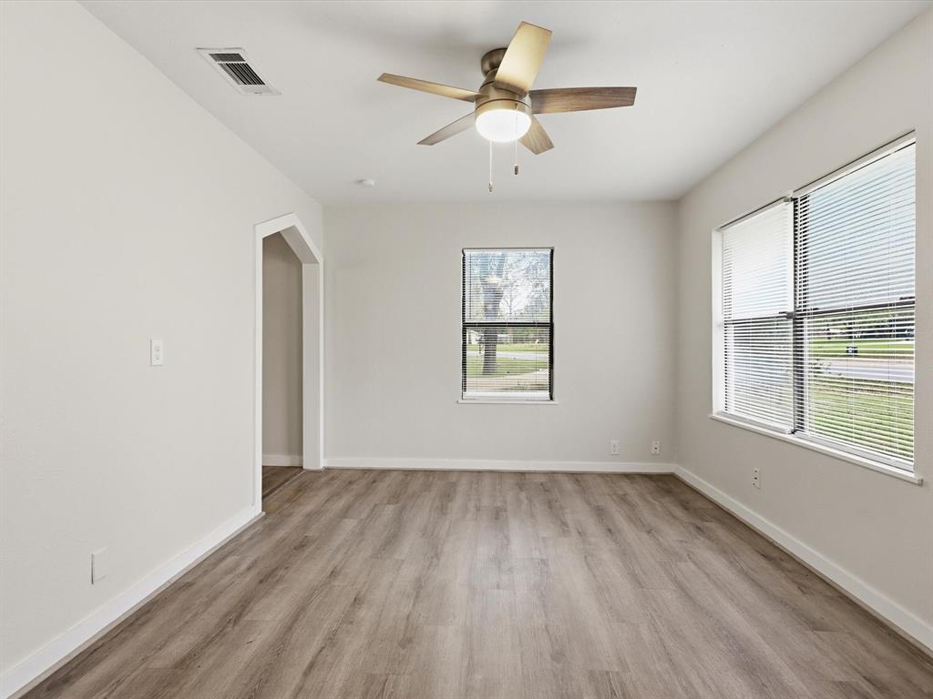 632 North Stewart Street Azle, TX 76020 - Photo 17 of 26 Spare room with light wood finished floors and a ceiling fan