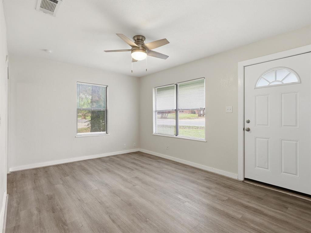 632 North Stewart Street Azle, TX 76020 - Photo 9 of 26 Entryway featuring light wood-style floors and ceiling fan