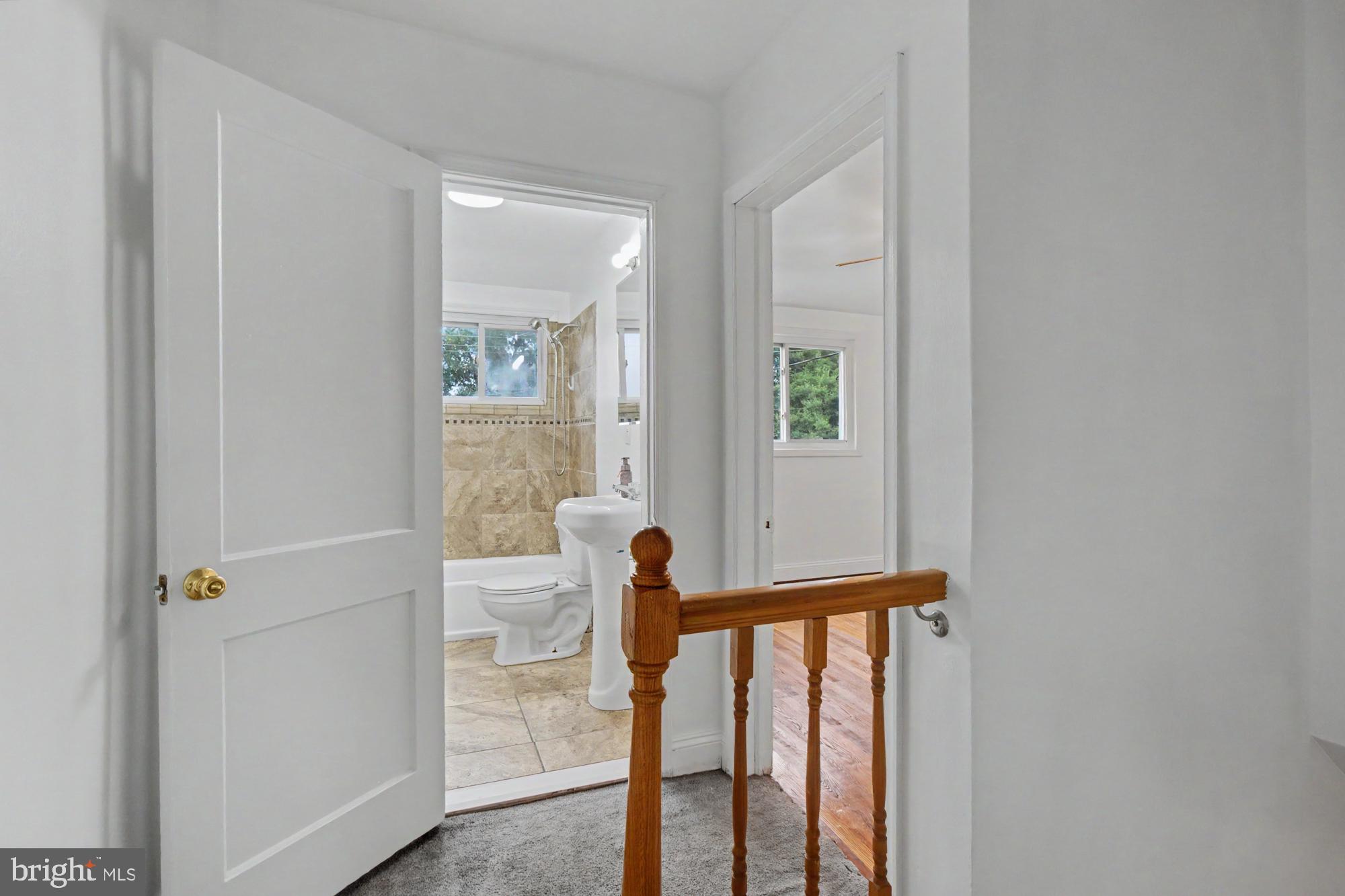 8218 Kavanagh Road Dundalk, MD 21222 - Photo 19 of 39 Bright and inviting hallway view.