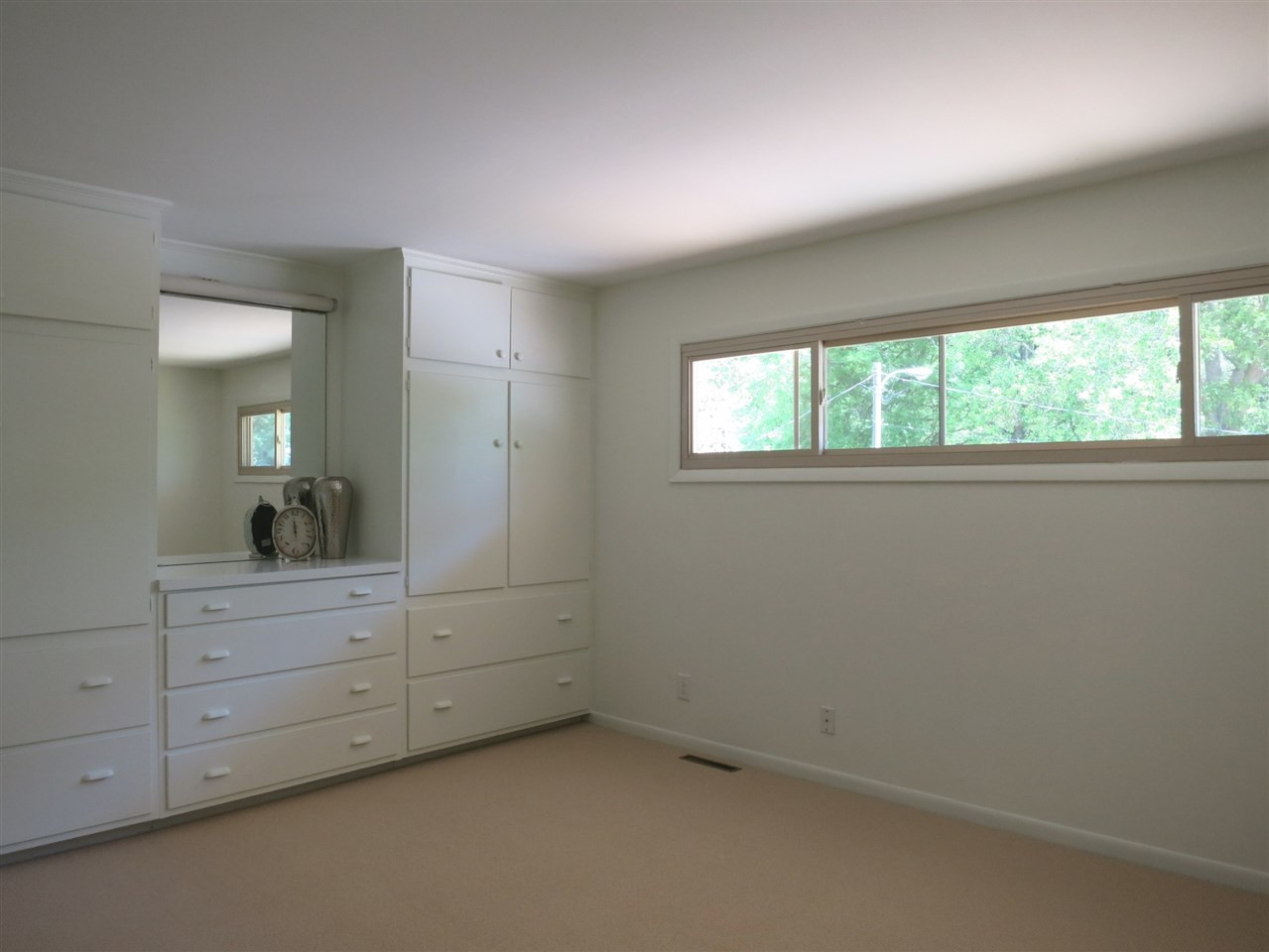 600 Davidson Street Raleigh, NC 27609 - Photo 16 of 25 This is Bedroom 3 which has a wall of built-in dressers/vanity w/mirror. Bedroom