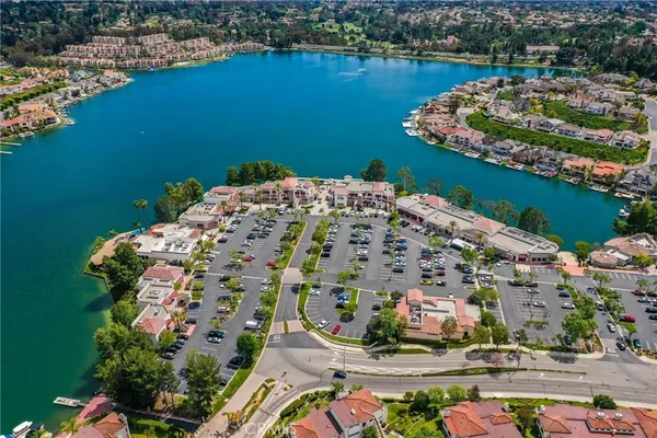 an aerial view of a house with a lake view