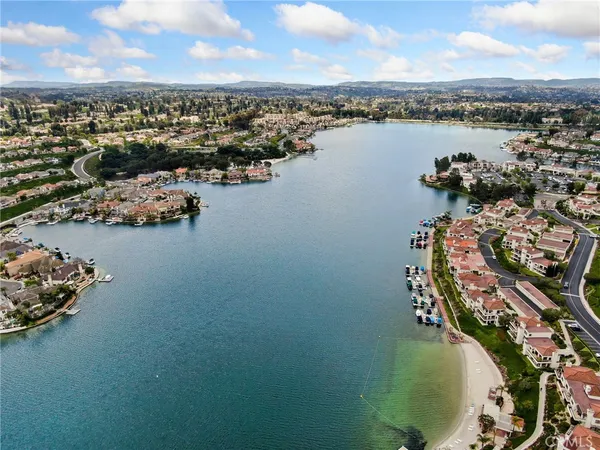 an aerial view of a house with a lake view