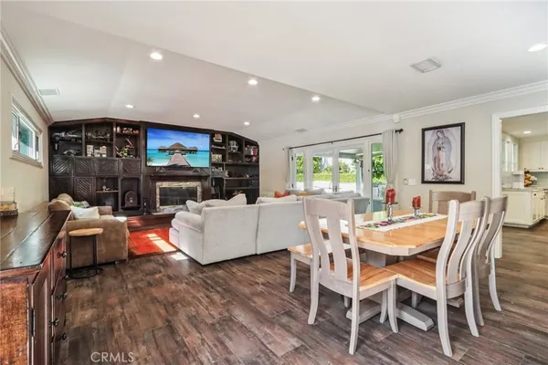 a living room with fireplace furniture and a flat screen tv