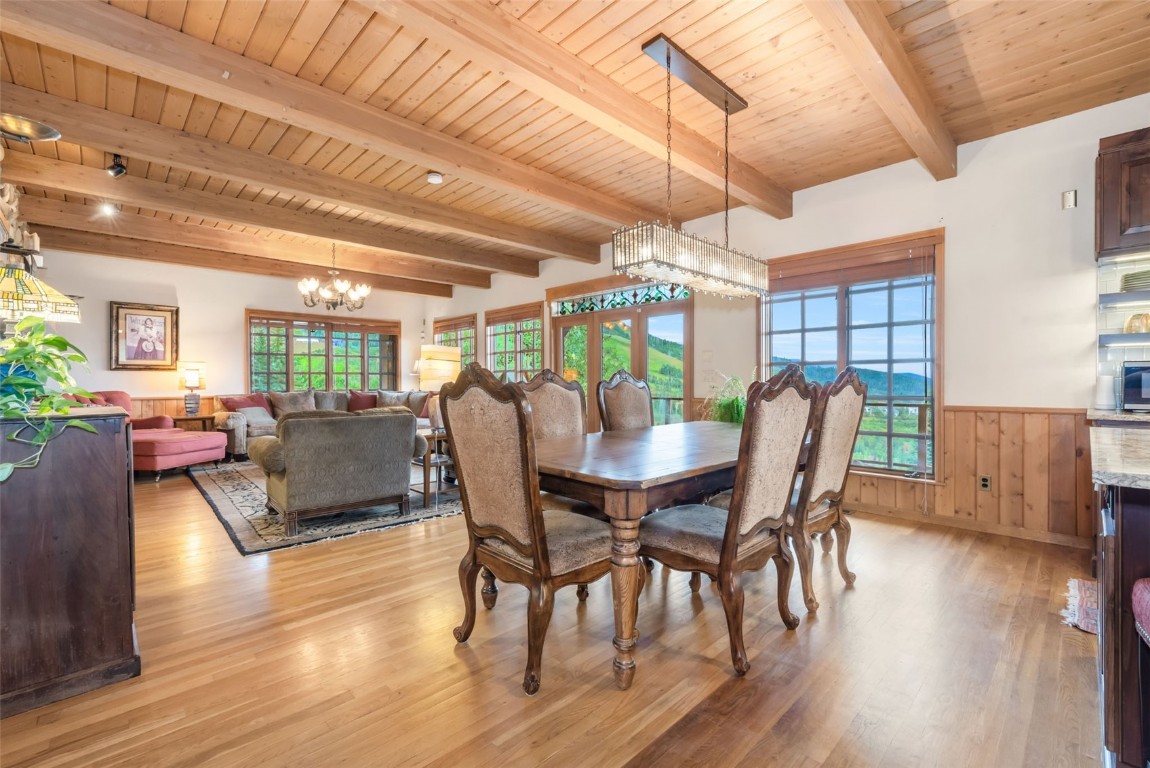 2300 Glacier Ridge Steamboat Springs, CO 80487 - Photo 12 of 50 a view of a dining room with furniture window and wooden floor