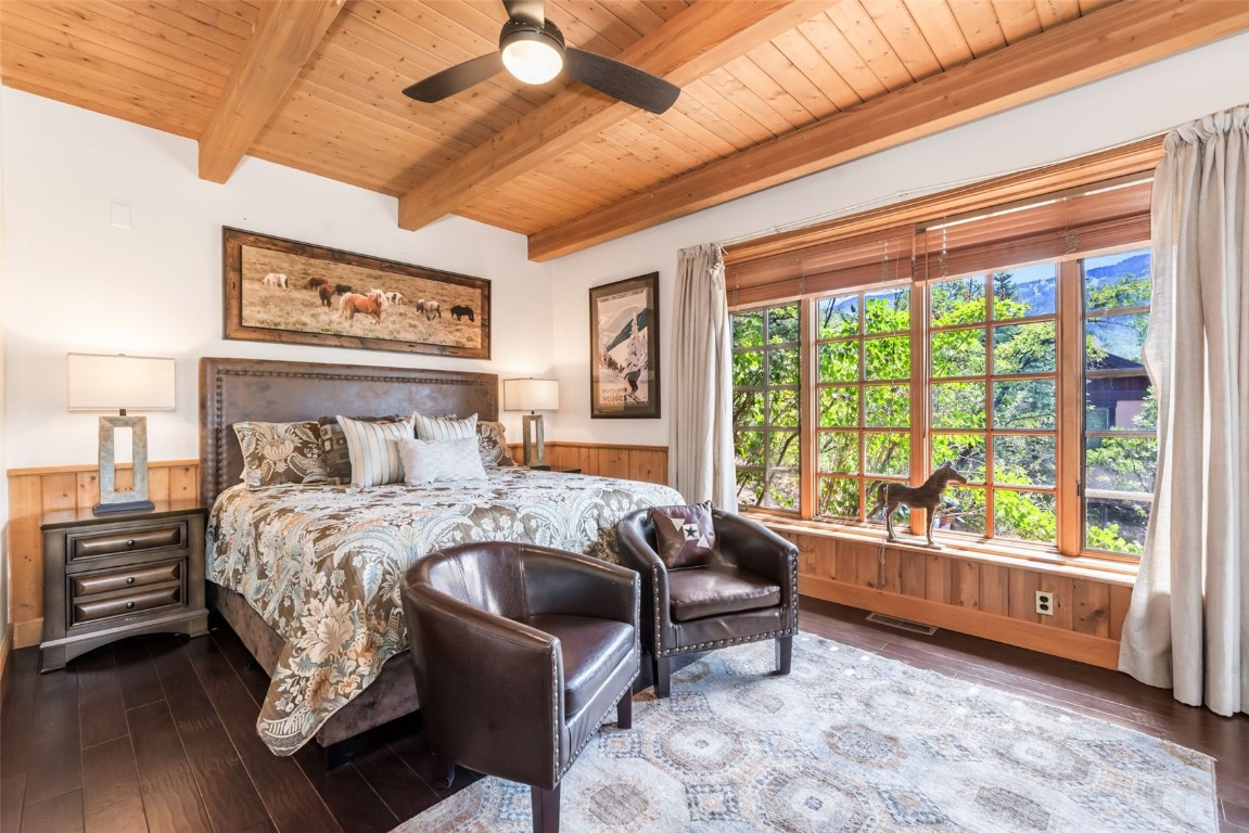 2300 Glacier Ridge Steamboat Springs, CO 80487 - Photo 19 of 50 a bed sitting in a bedroom next to a window