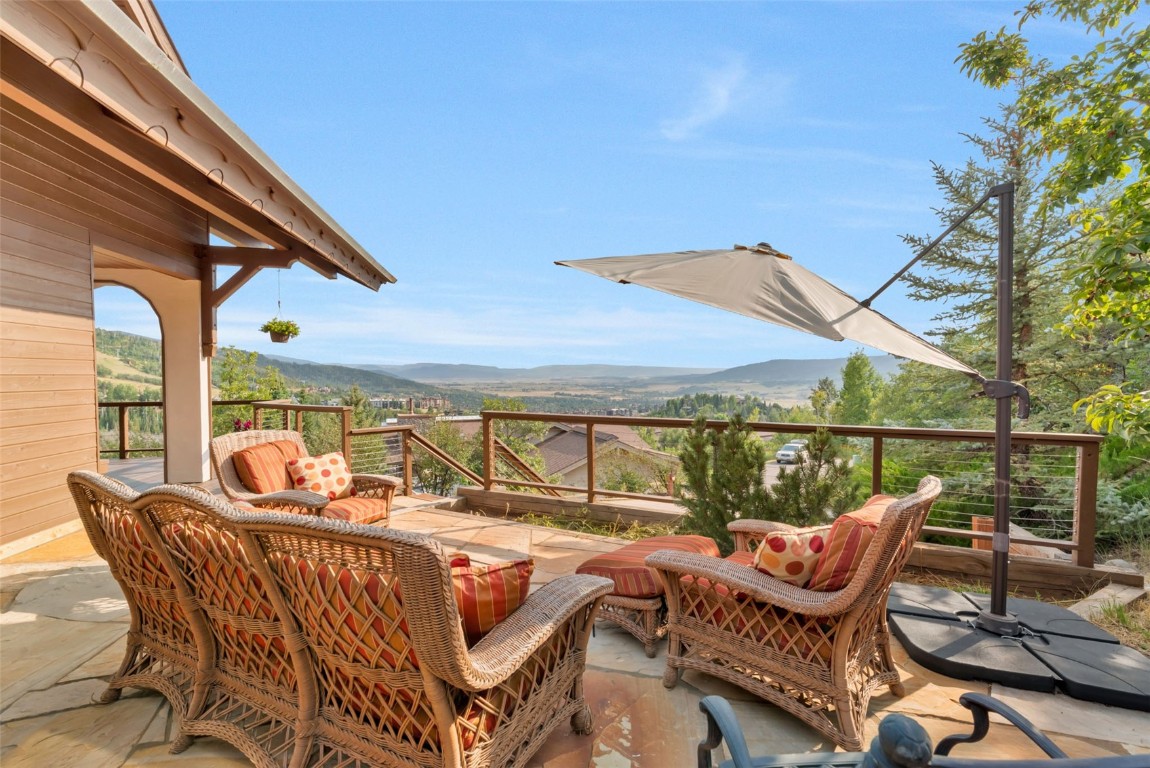 2300 Glacier Ridge Steamboat Springs, CO 80487 - Photo 2 of 50 a roof deck with outdoor seating and city view