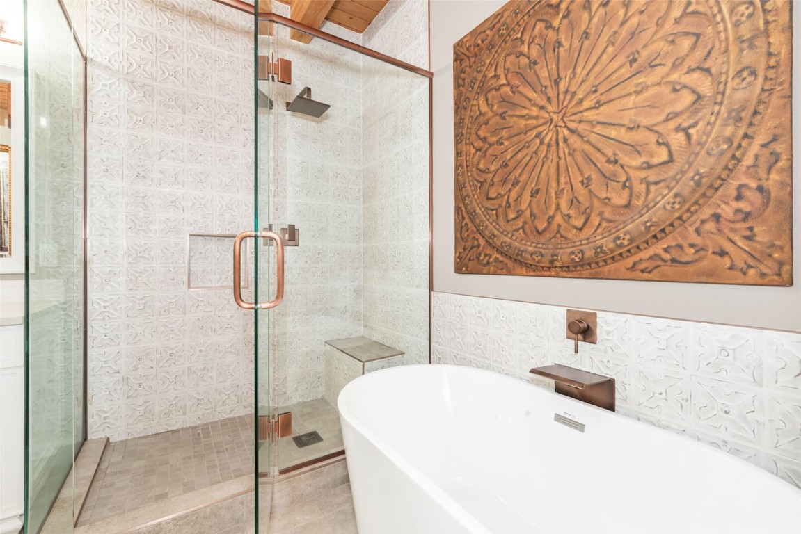 2300 Glacier Ridge Steamboat Springs, CO 80487 - Photo 24 of 50 a bathroom with a bathtub and shower