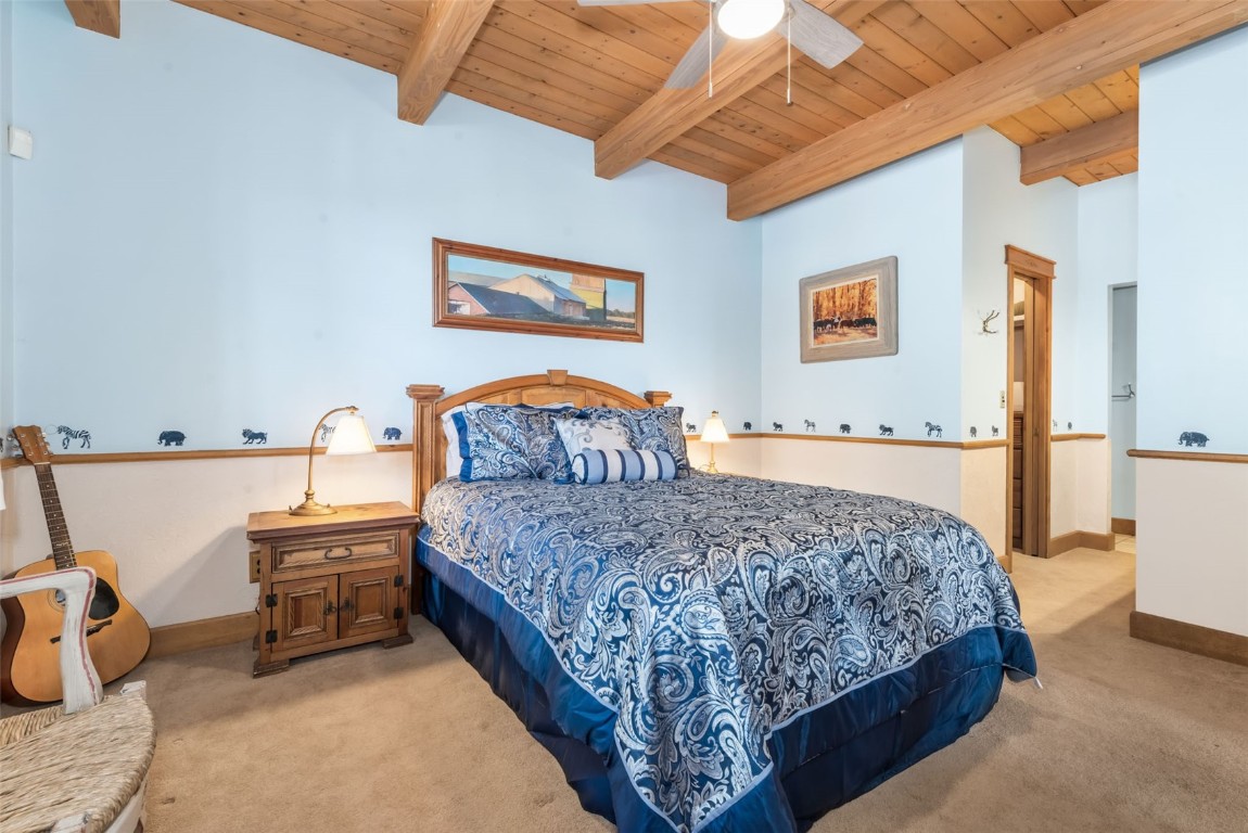 2300 Glacier Ridge Steamboat Springs, CO 80487 - Photo 25 of 50 a bedroom with a bed and dresser