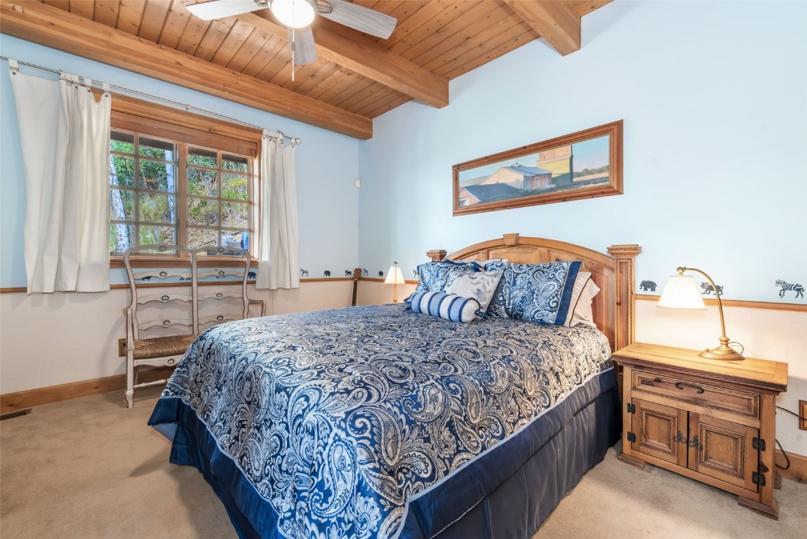 2300 Glacier Ridge Steamboat Springs, CO 80487 - Photo 26 of 50 a bedroom with a large bed and a window
