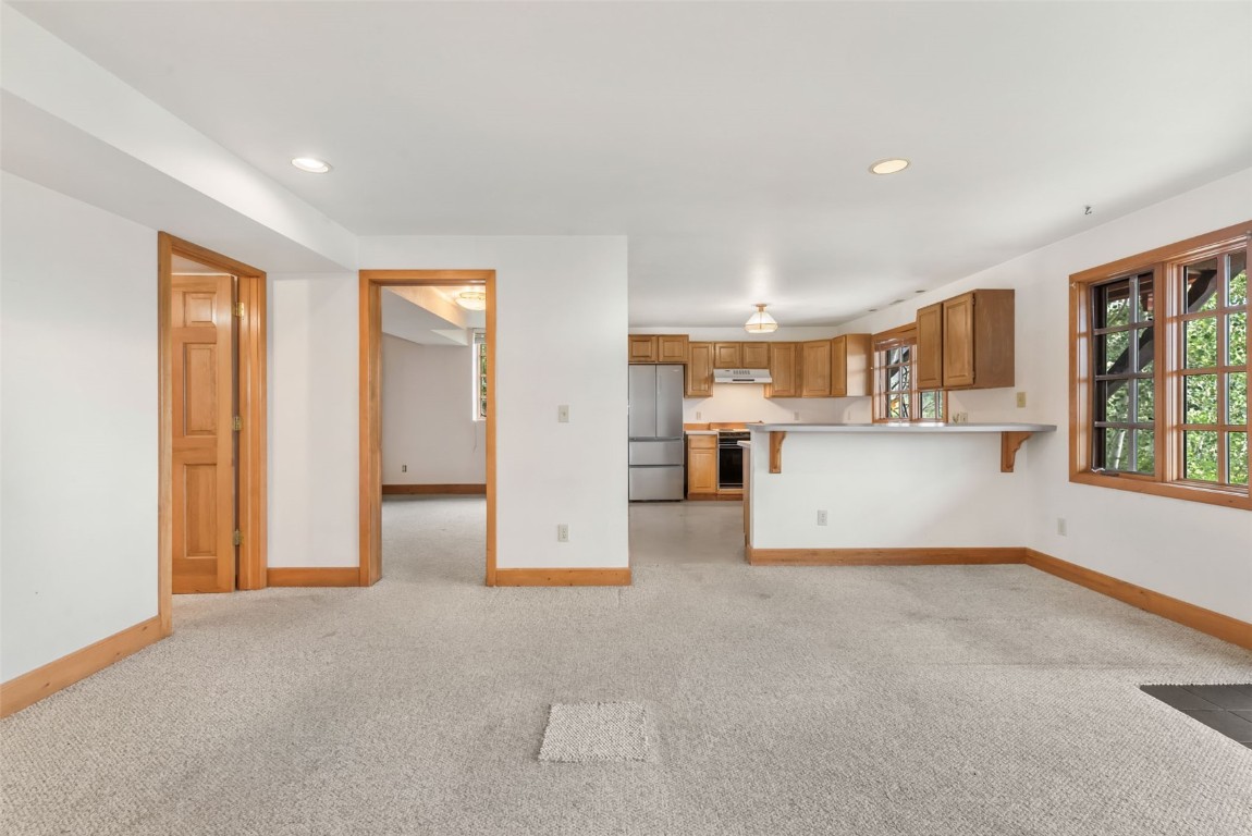 2300 Glacier Ridge Steamboat Springs, CO 80487 - Photo 43 of 50 a view of a kitchen with furniture and a window
