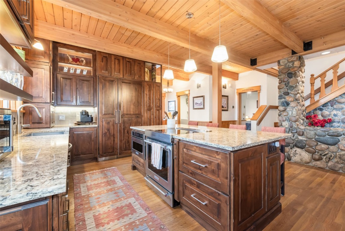 2300 Glacier Ridge Steamboat Springs, CO 80487 - Photo 9 of 50 a kitchen that has a lot of cabinets in it