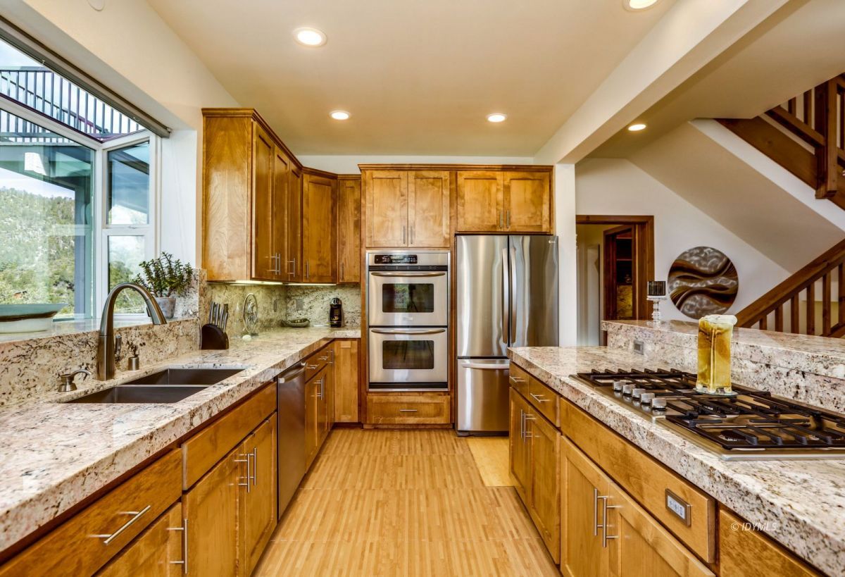 25126 Cougar Road Idyllwild, CA 92549 - Photo 11 of 63 a kitchen with stainless steel appliances granite countertop a stove and a sink