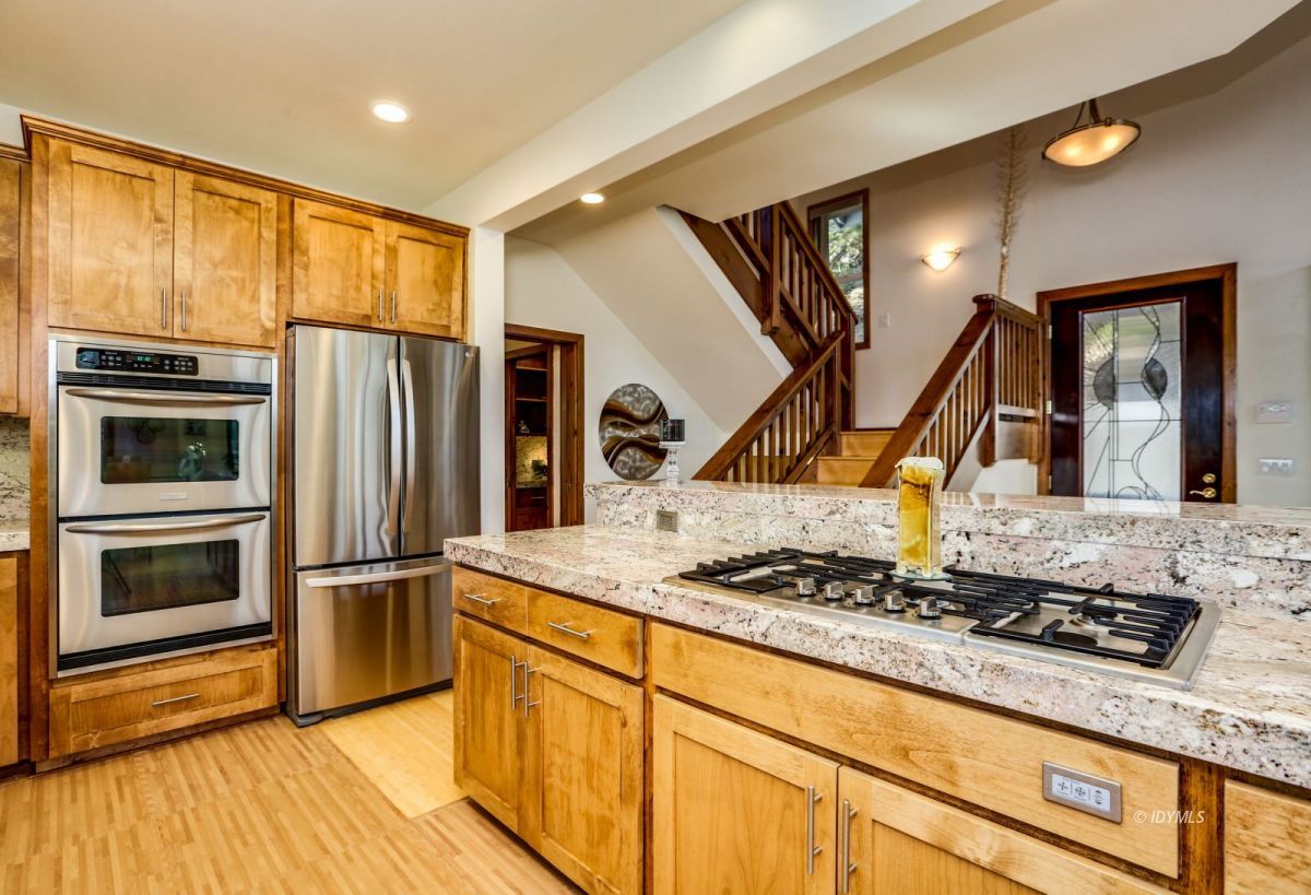 25126 Cougar Road Idyllwild, CA 92549 - Photo 12 of 63 a kitchen with stainless steel appliances granite countertop a stove and a refrigerator