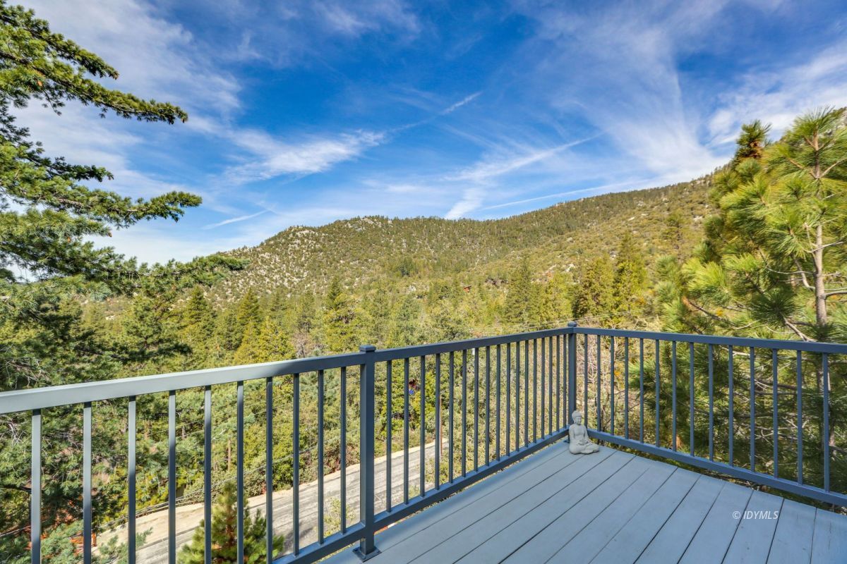 25126 Cougar Road Idyllwild, CA 92549 - Photo 26 of 63 a view of a balcony with wooden floor and fence