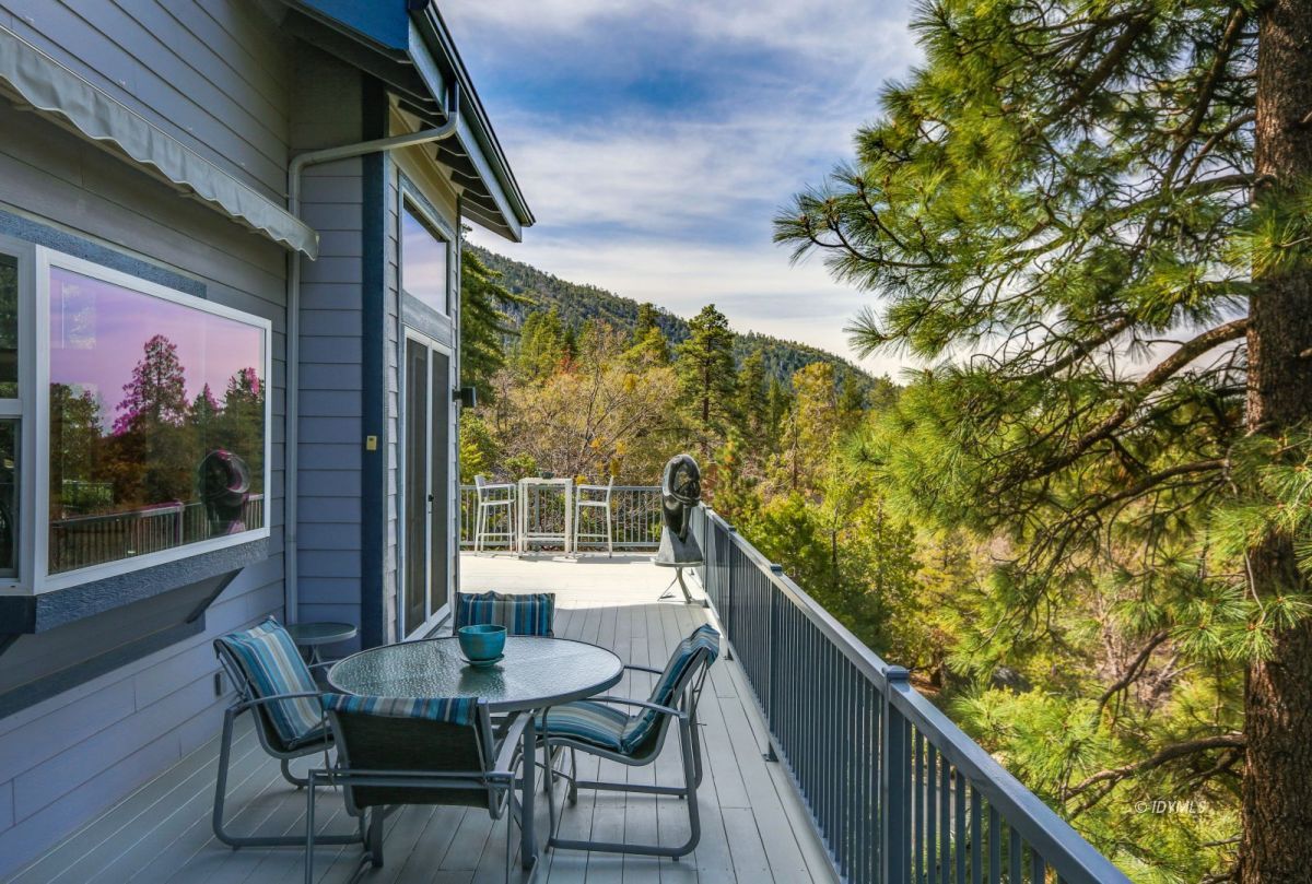 25126 Cougar Road Idyllwild, CA 92549 - Photo 48 of 63 a view of a chairs and table in the balcony