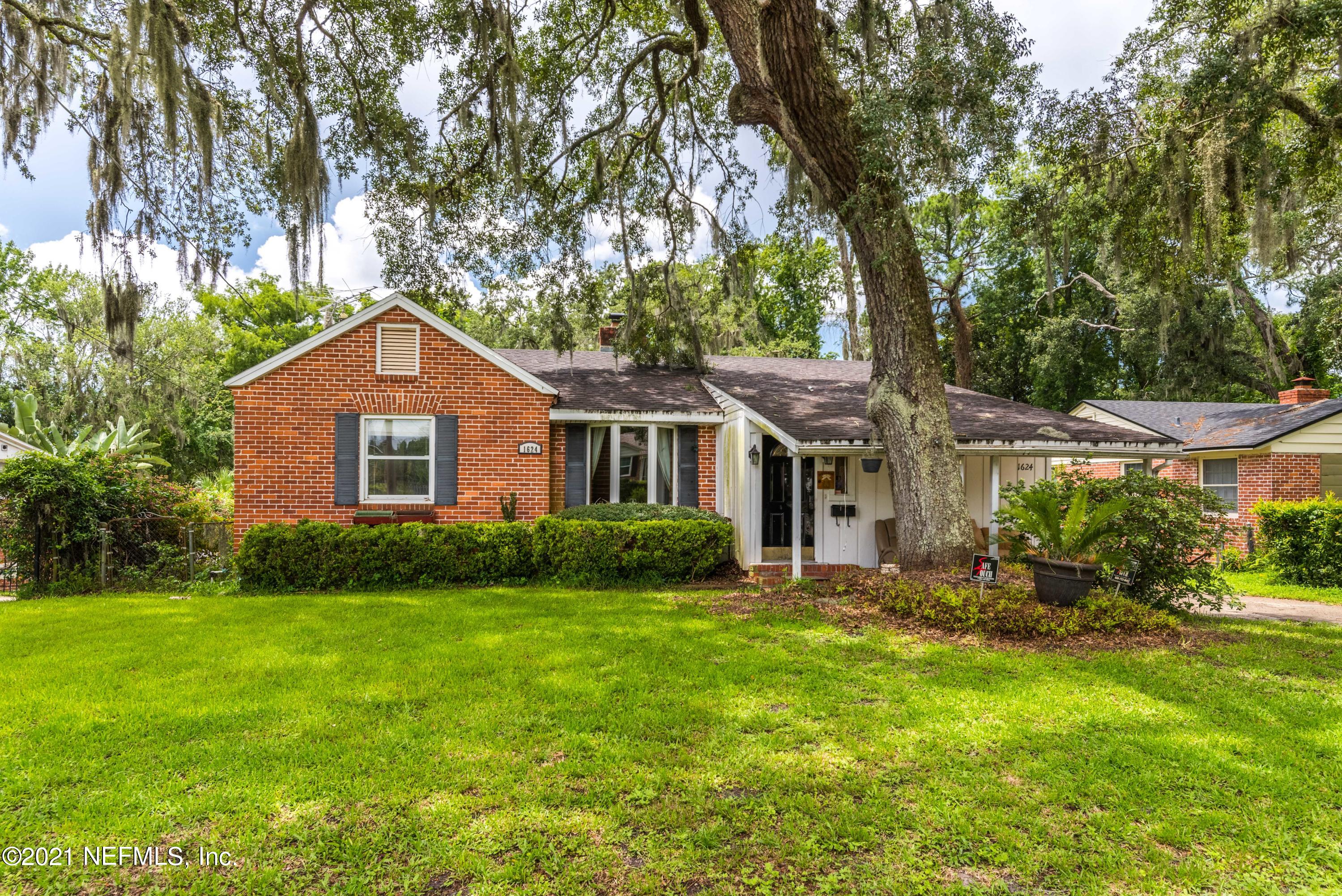 1624 Mayfair Road Jacksonville, FL 32207 - Photo 1 of 23 a front view of a house with a garden