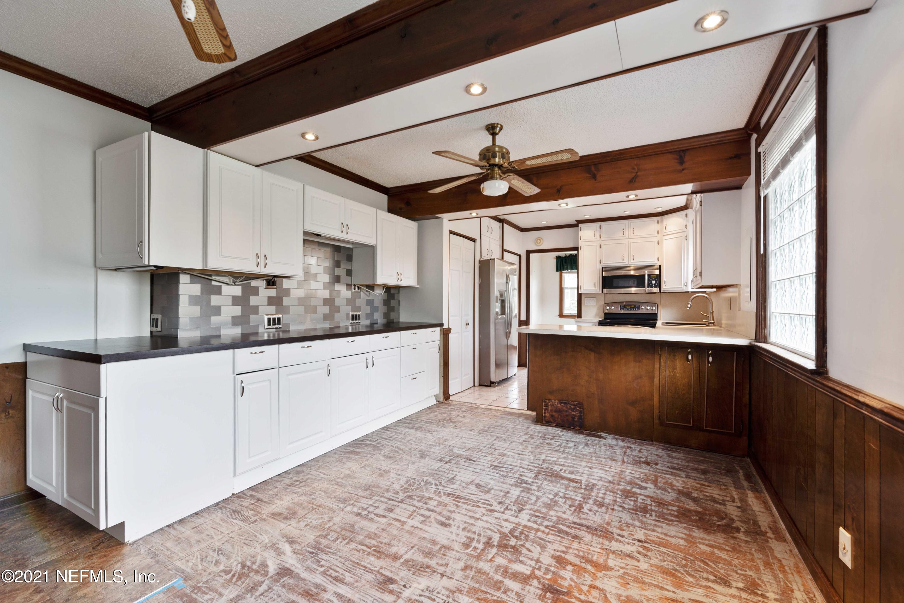 1624 Mayfair Road Jacksonville, FL 32207 - Photo 11 of 23 a kitchen with stainless steel appliances granite countertop a refrigerator and a stove top oven