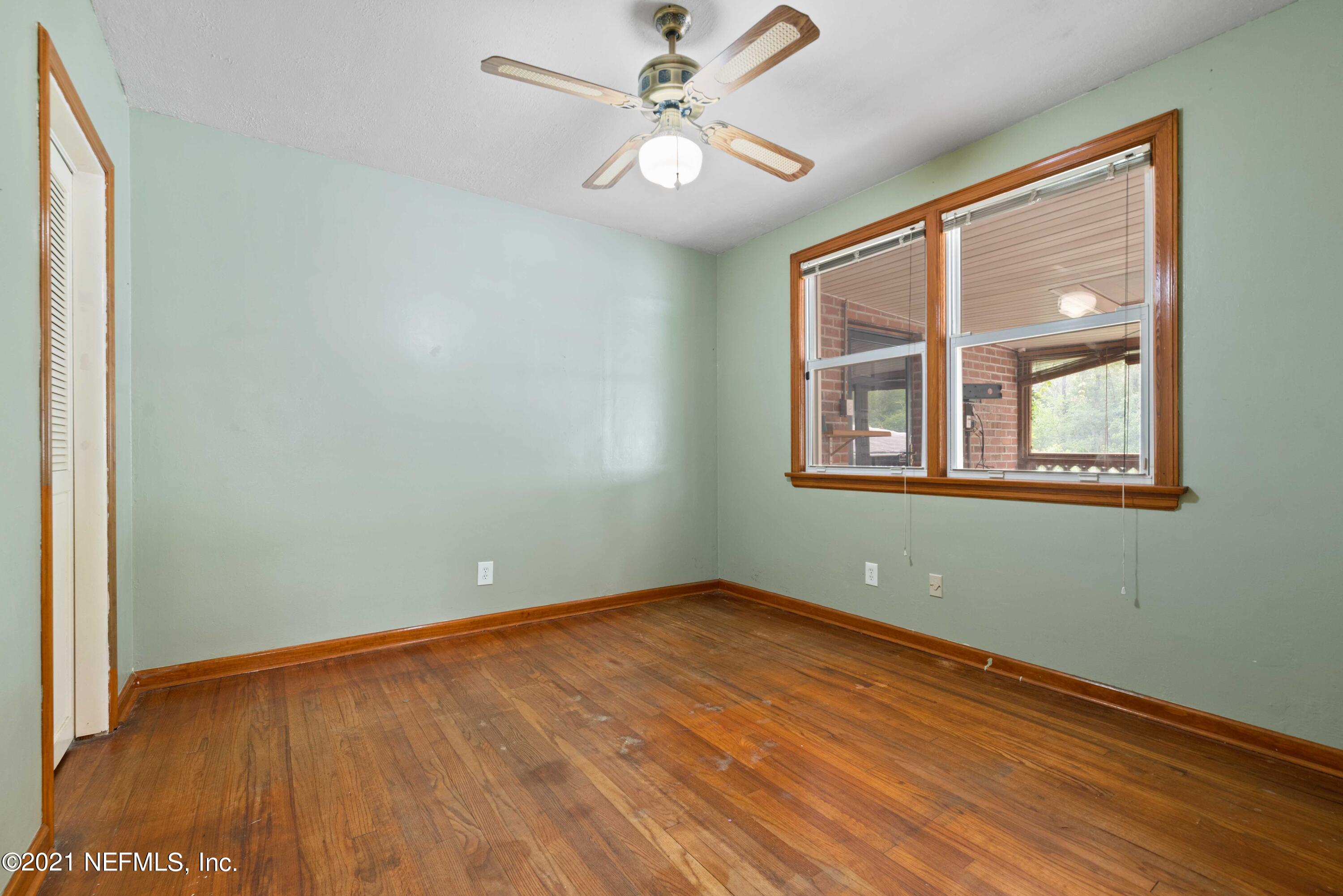 1624 Mayfair Road Jacksonville, FL 32207 - Photo 14 of 23 an empty room with a window and a fan