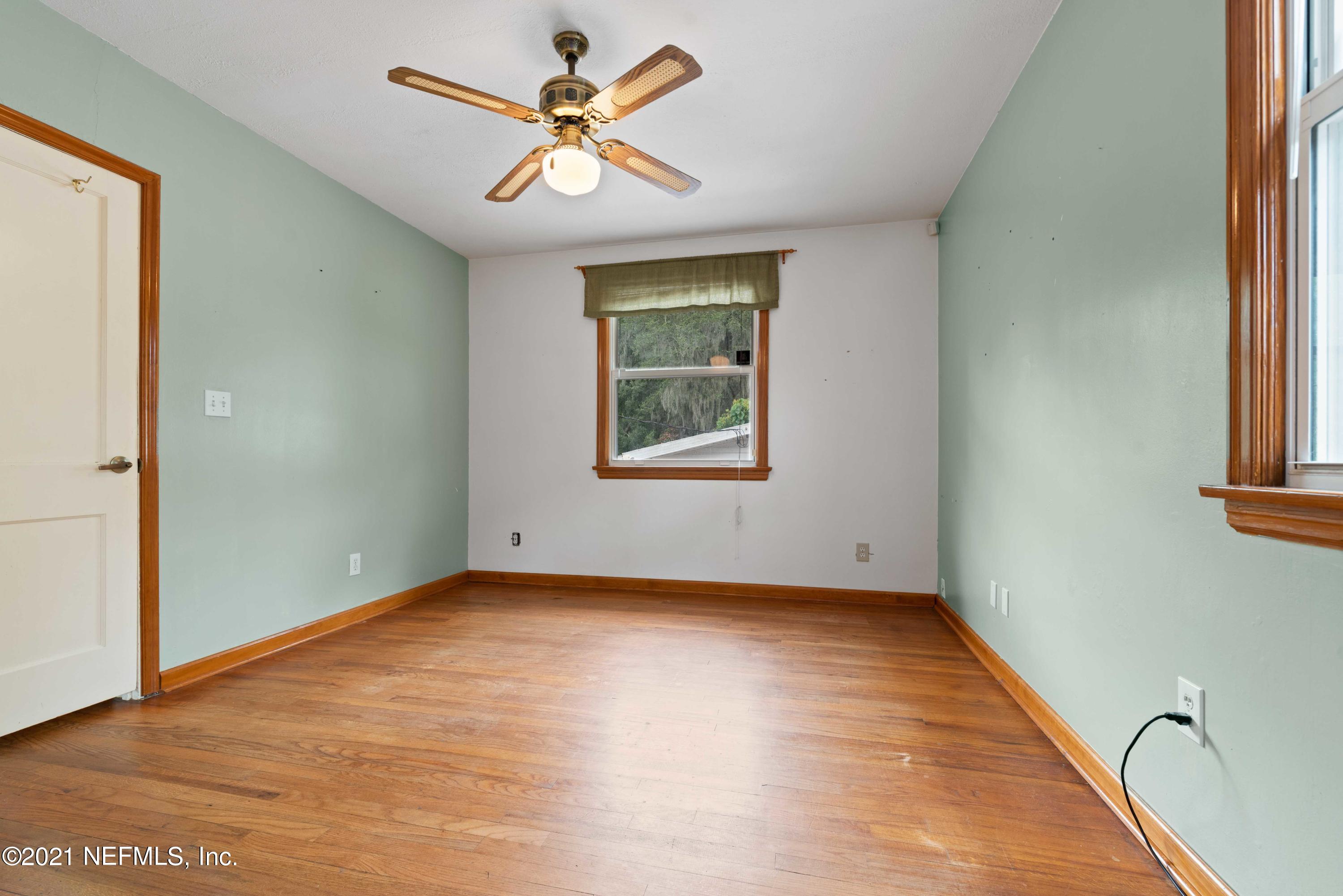 1624 Mayfair Road Jacksonville, FL 32207 - Photo 16 of 23 wooden floor in an empty room with a window