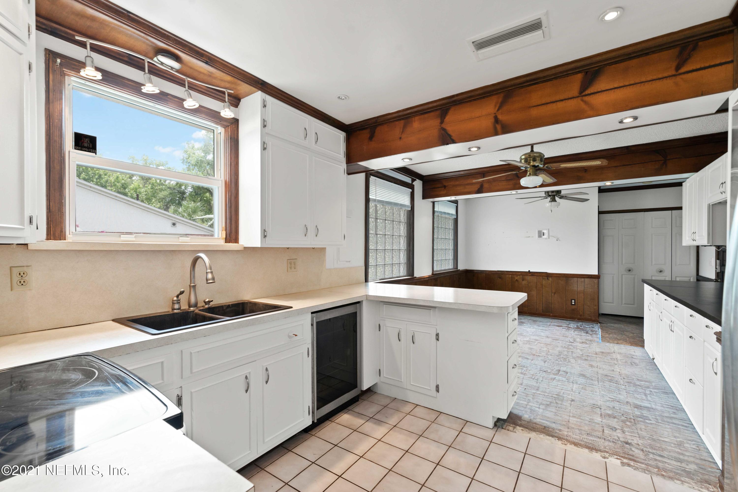 1624 Mayfair Road Jacksonville, FL 32207 - Photo 7 of 23 a kitchen that has a sink a stove and a window