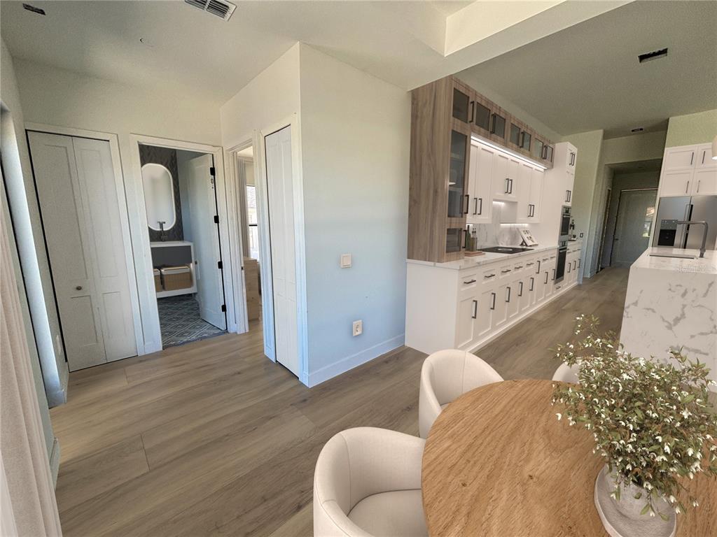 215 Bunker Road Rotonda West, FL 33947 - Photo 14 of 46 a bedroom with a bed and a couch