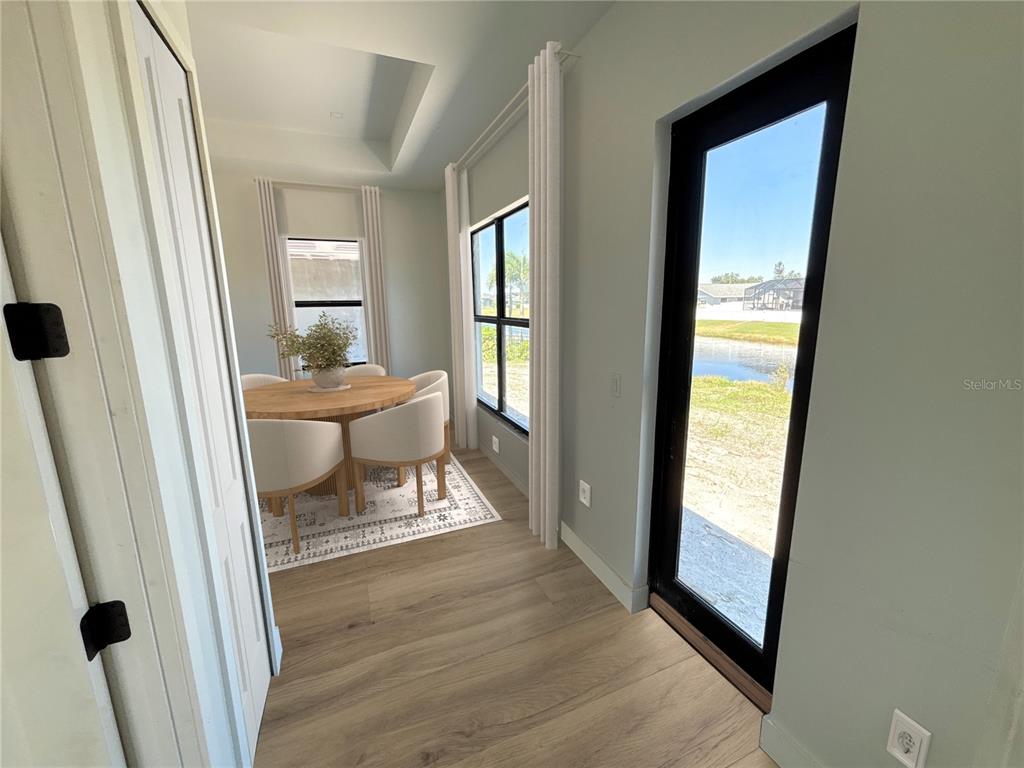 215 Bunker Road Rotonda West, FL 33947 - Photo 16 of 46 a living room with furniture and a window