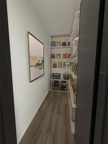 a bathroom with a toilet a sink and a mirror