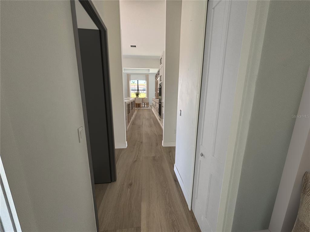 215 Bunker Road Rotonda West, FL 33947 - Photo 19 of 46 a view of hallway with wooden floor