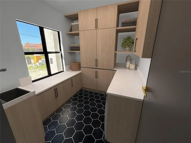 a bedroom with bed and a large window