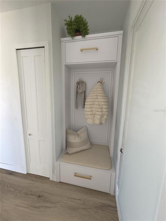 215 Bunker Road Rotonda West, FL 33947 - Photo 21 of 46 a hallway with a wooden floor