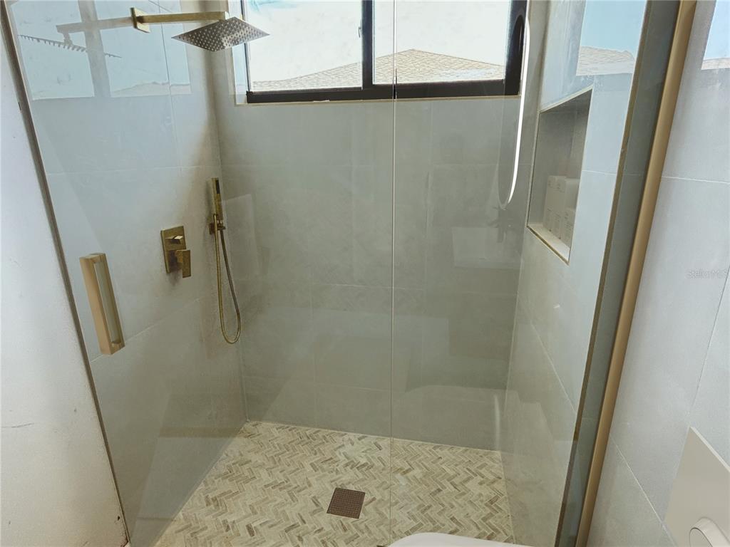 215 Bunker Road Rotonda West, FL 33947 - Photo 27 of 46 a bathroom with a shower