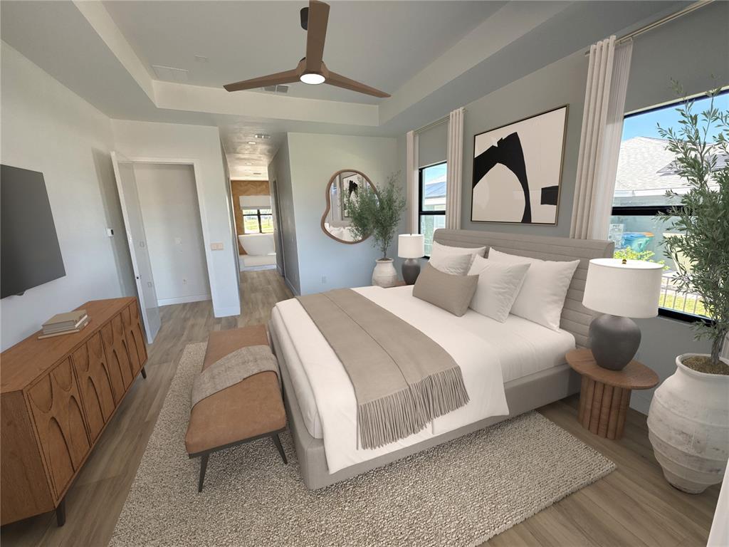 215 Bunker Road Rotonda West, FL 33947 - Photo 30 of 46 a bedroom with a bed lamp and a large window