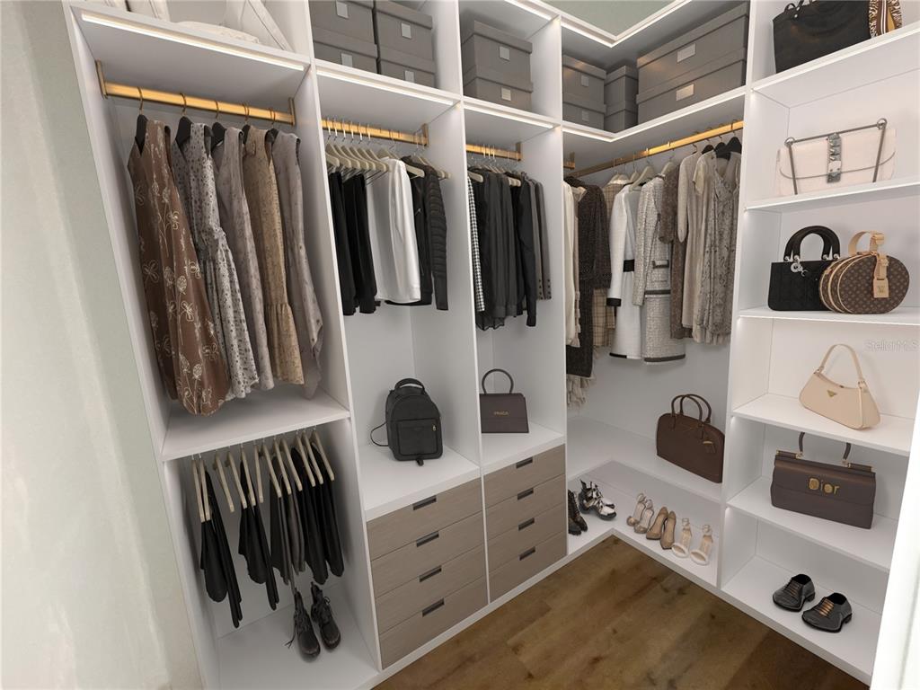 215 Bunker Road Rotonda West, FL 33947 - Photo 31 of 46 a view of walk in closet with clothes and shoes