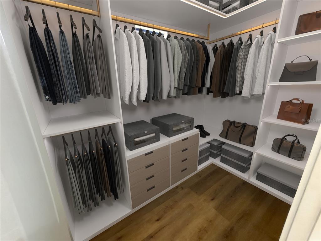 215 Bunker Road Rotonda West, FL 33947 - Photo 32 of 46 a view of walk in closet with clothes and shoes