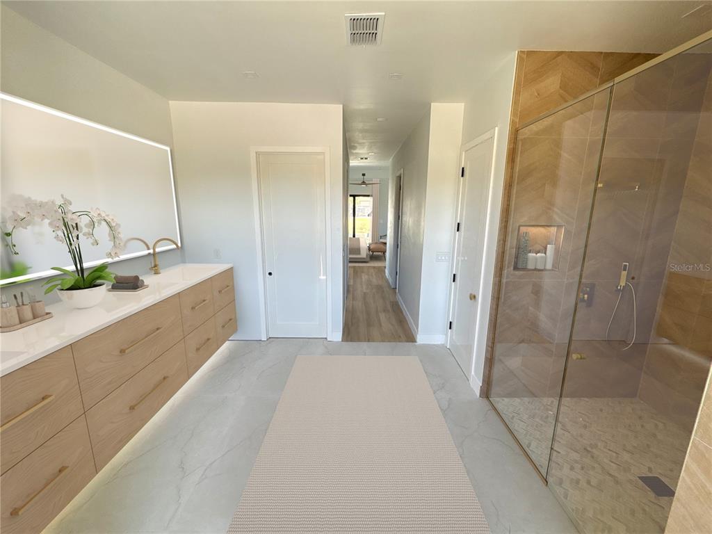 215 Bunker Road Rotonda West, FL 33947 - Photo 36 of 46 a bathroom with a double vanity sink and shower