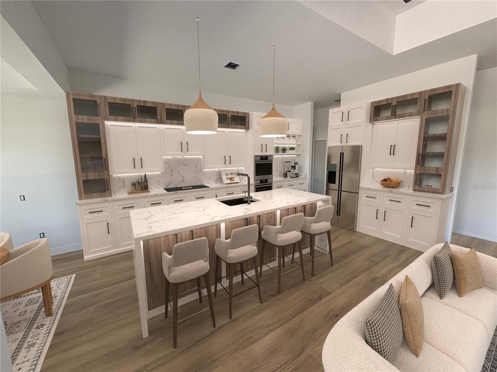 215 Bunker Road Rotonda West, FL 33947 - Photo 10 of 46 a kitchen with stainless steel appliances kitchen island granite countertop a dining table chairs and a refrigerator