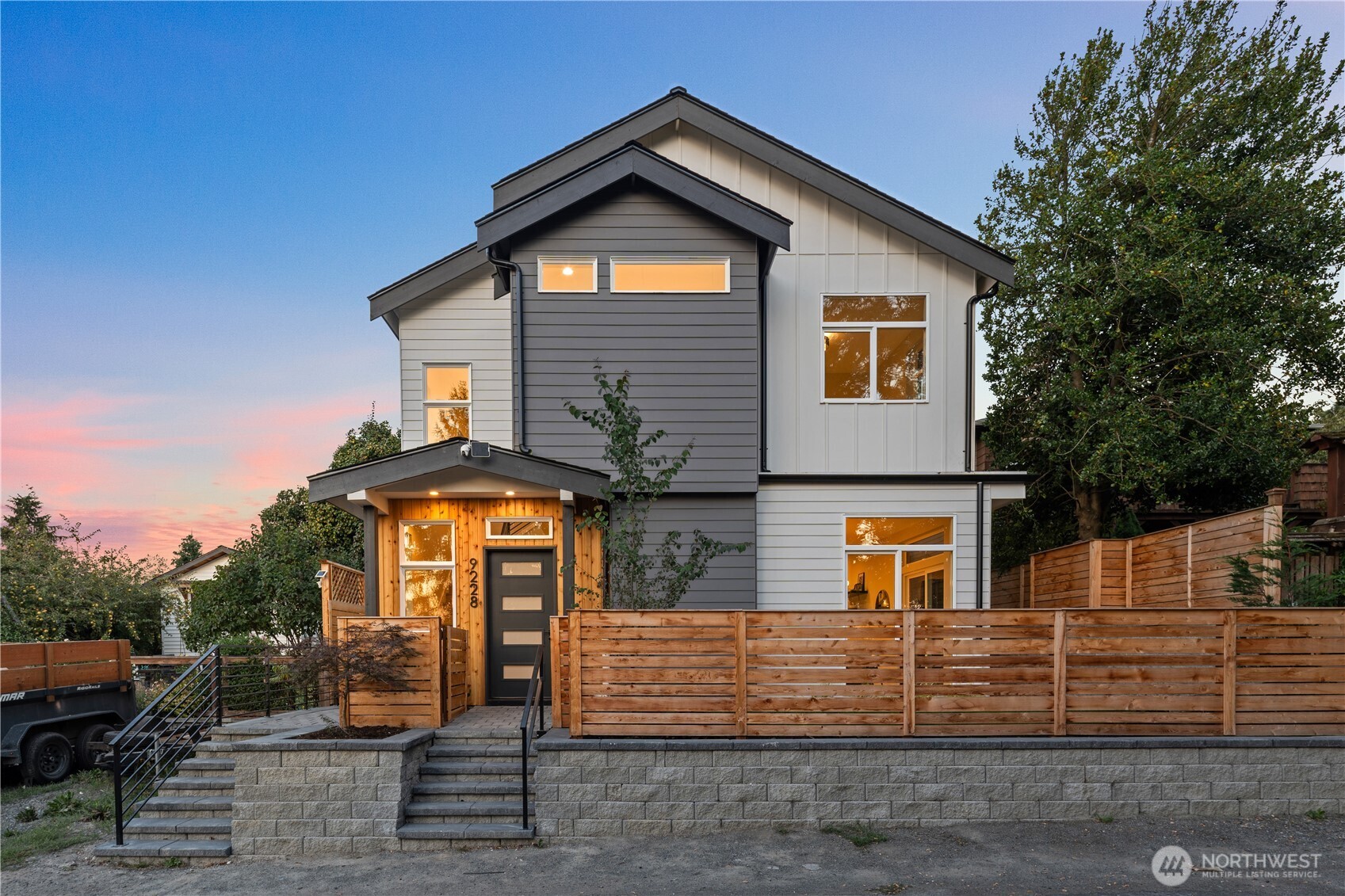 9230 22nd Avenue Southwest Seattle, WA 98106 - Photo 1 of 26 a front view of a house with garden