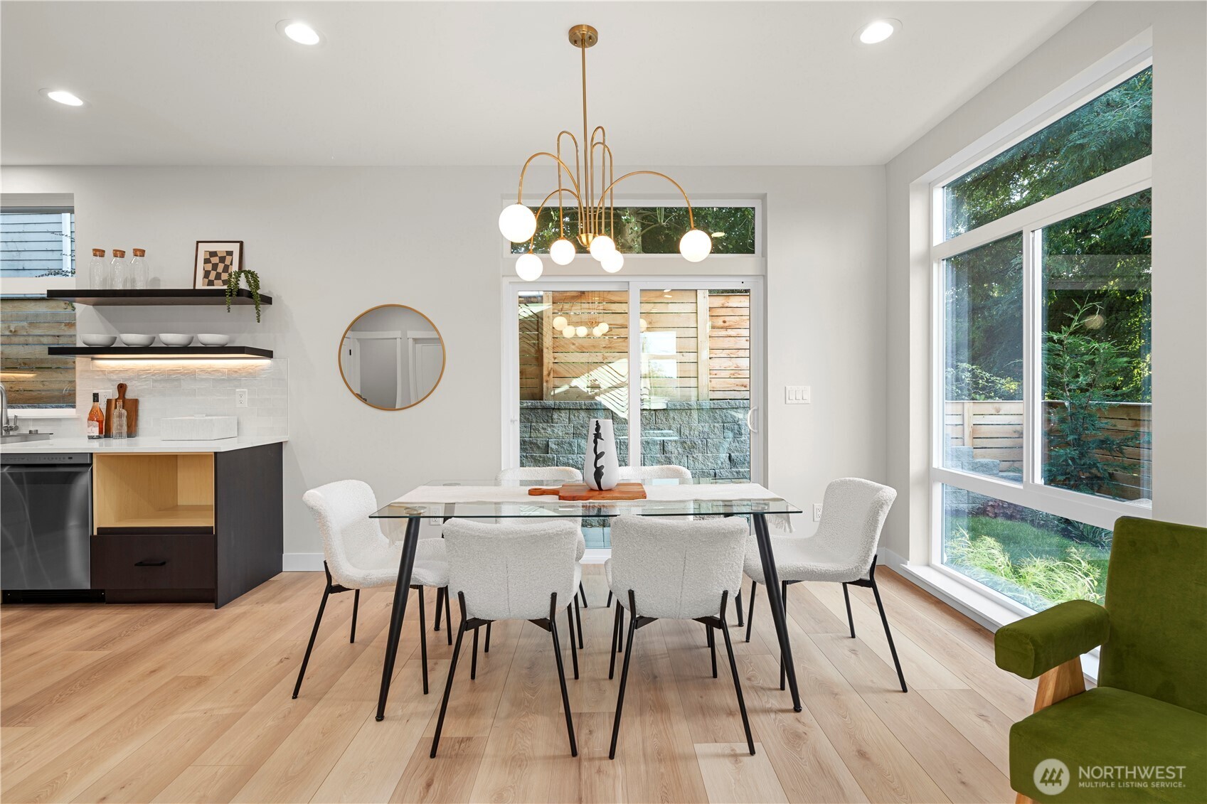 9230 22nd Avenue Southwest Seattle, WA 98106 - Photo 11 of 26 a dining room with furniture a window and wooden floor