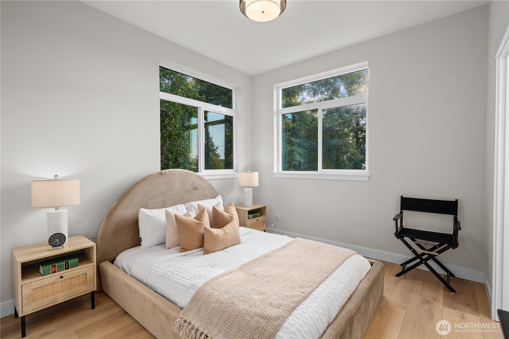 9230 22nd Avenue Southwest Seattle, WA 98106 - Photo 14 of 26 a bedroom with a bed a table and a window