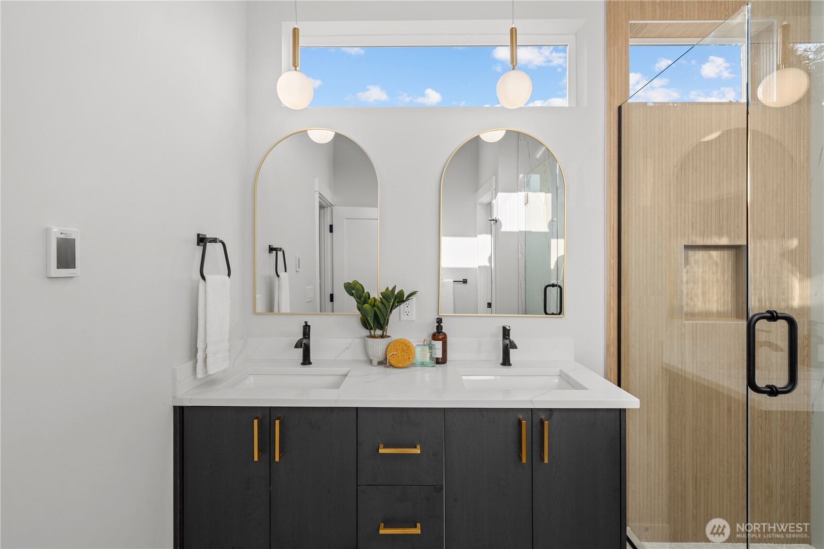 9230 22nd Avenue Southwest Seattle, WA 98106 - Photo 15 of 26 a bathroom with a double vanity sink and a mirror