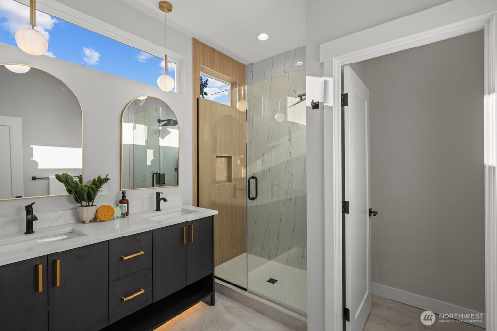 9230 22nd Avenue Southwest Seattle, WA 98106 - Photo 16 of 26 a bathroom with a double vanity sink mirror and shower