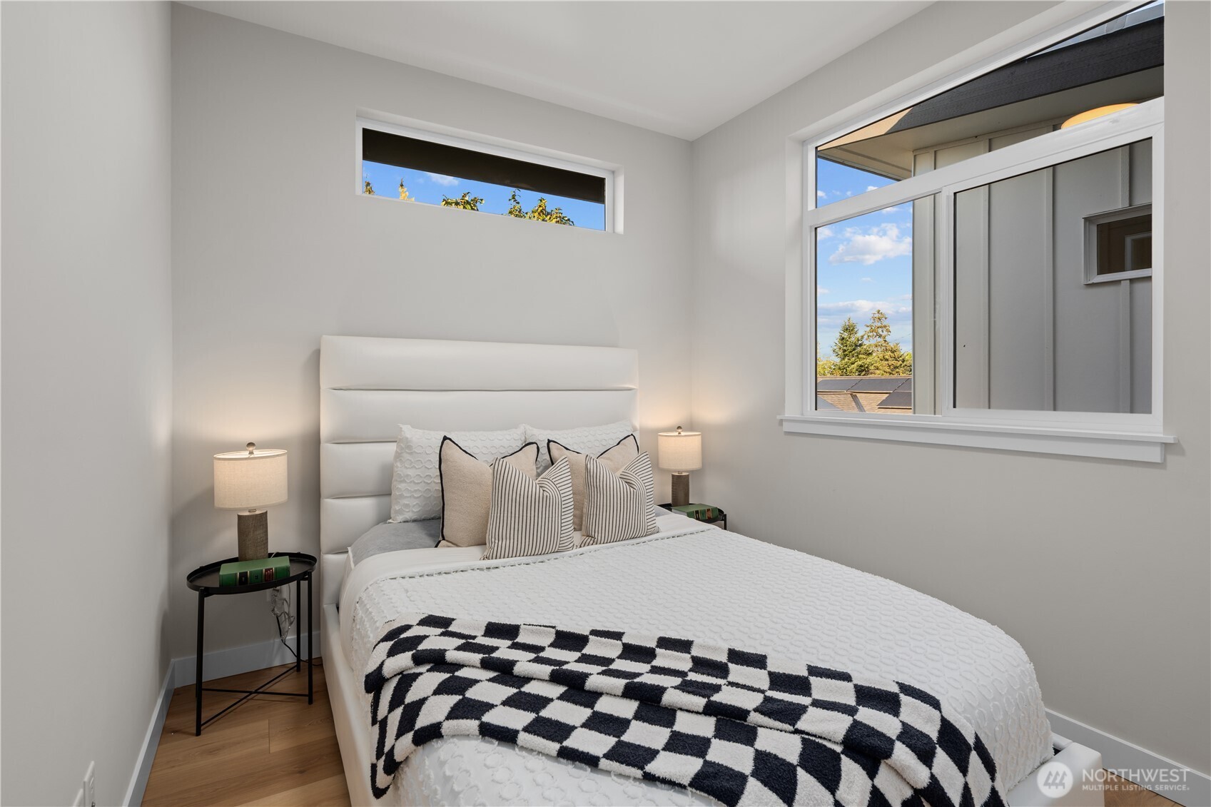 9230 22nd Avenue Southwest Seattle, WA 98106 - Photo 20 of 26 a bedroom with a bed and a window