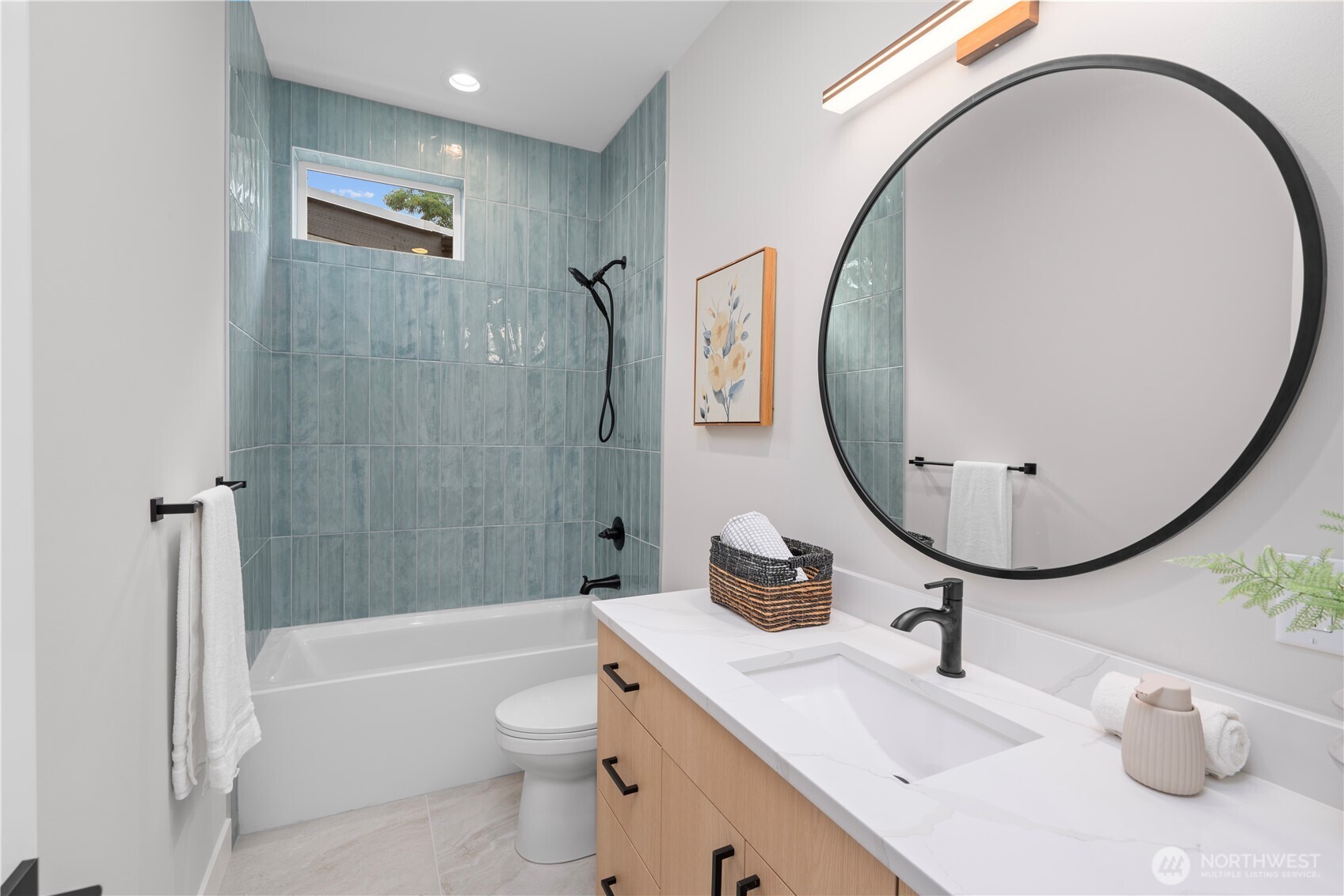 9230 22nd Avenue Southwest Seattle, WA 98106 - Photo 22 of 26 a bathroom with a sink a toilet and a mirror